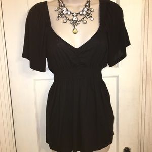 Limited knit top with shirred waist. Size S